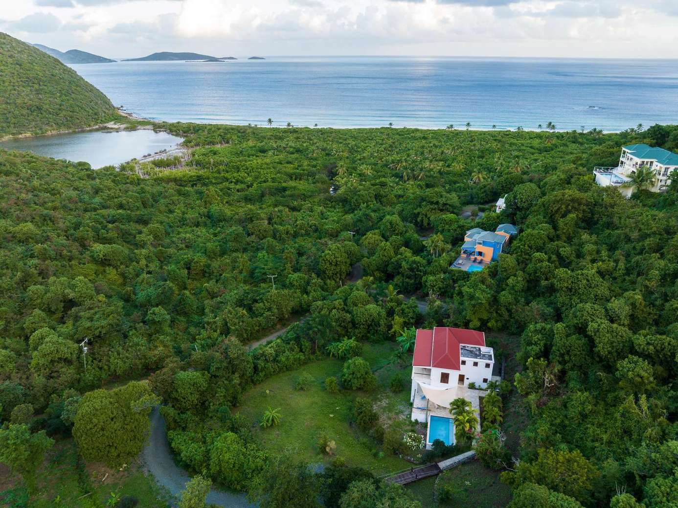 Secluded villa surrounded by lush greenery and ocean views