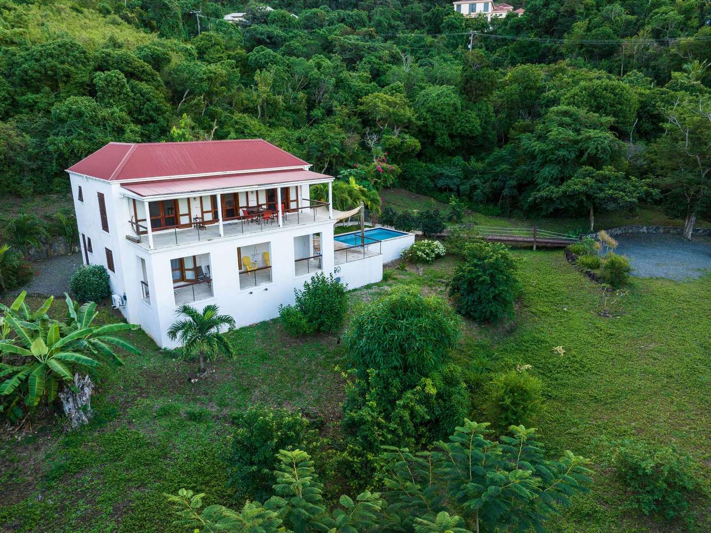 Secluded villa with private pool surrounded by lush greenery