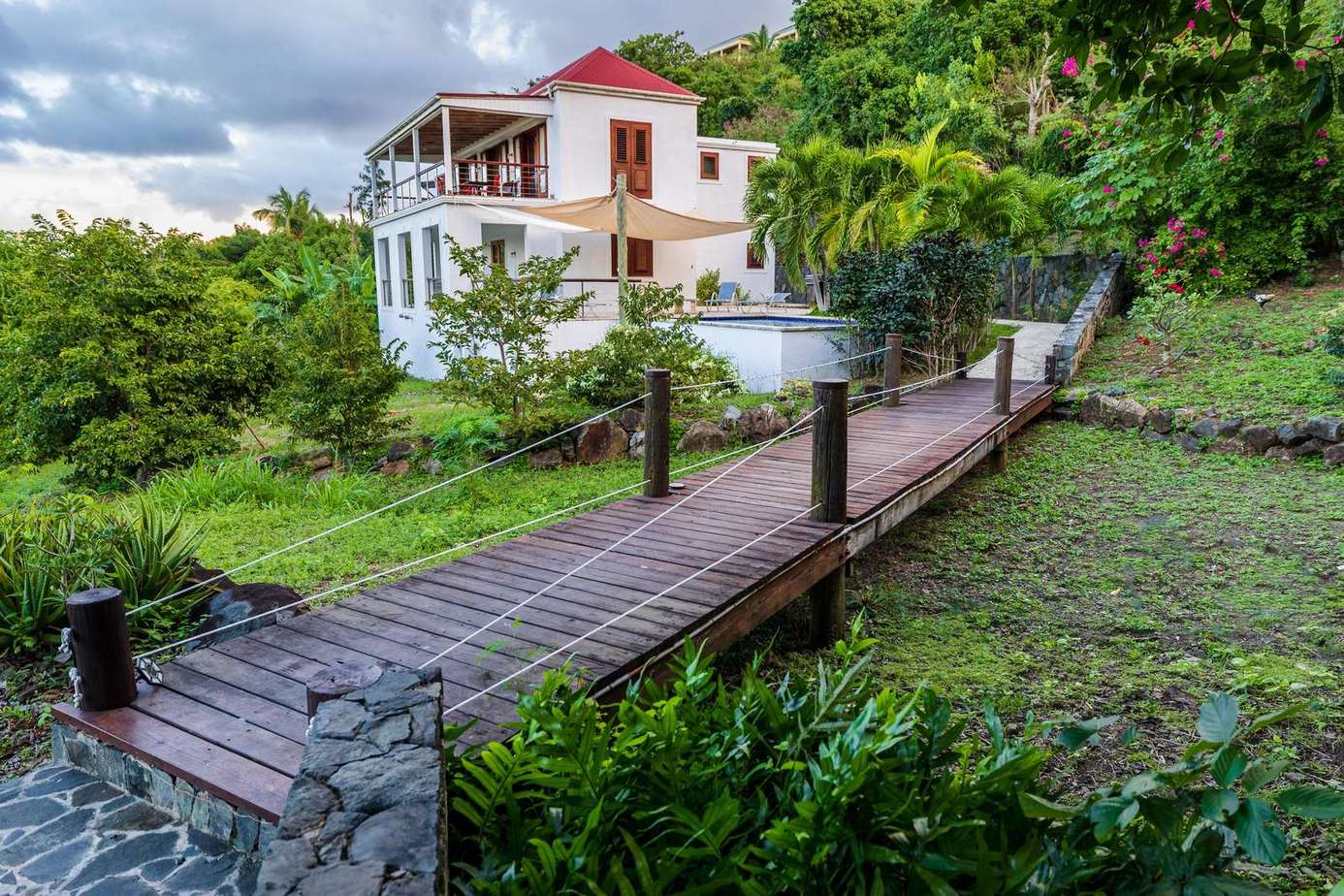 Charming home with scenic garden and peaceful wooden bridge walkway