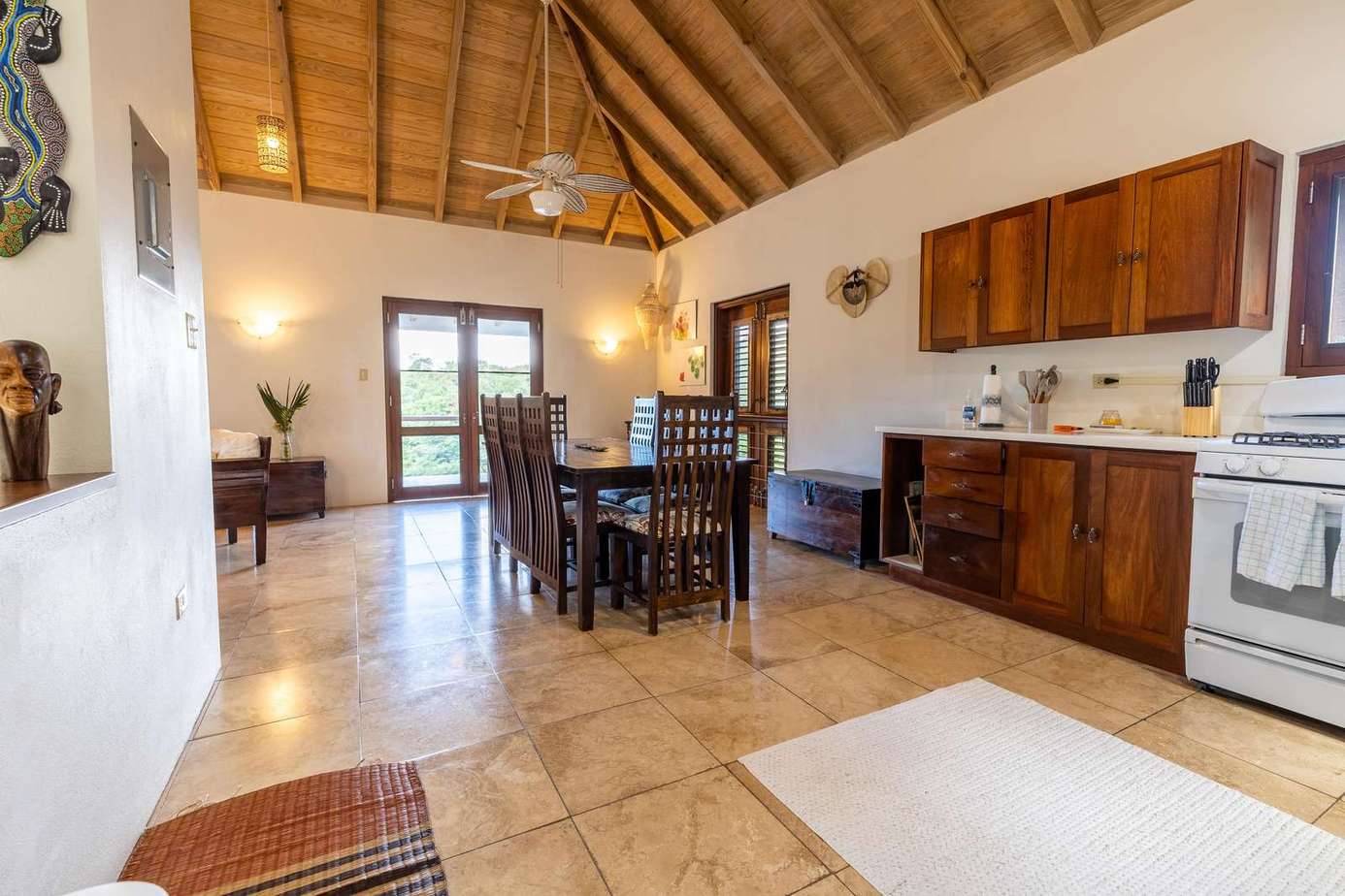 Spacious open-concept kitchen and dining area with vaulted ceilings