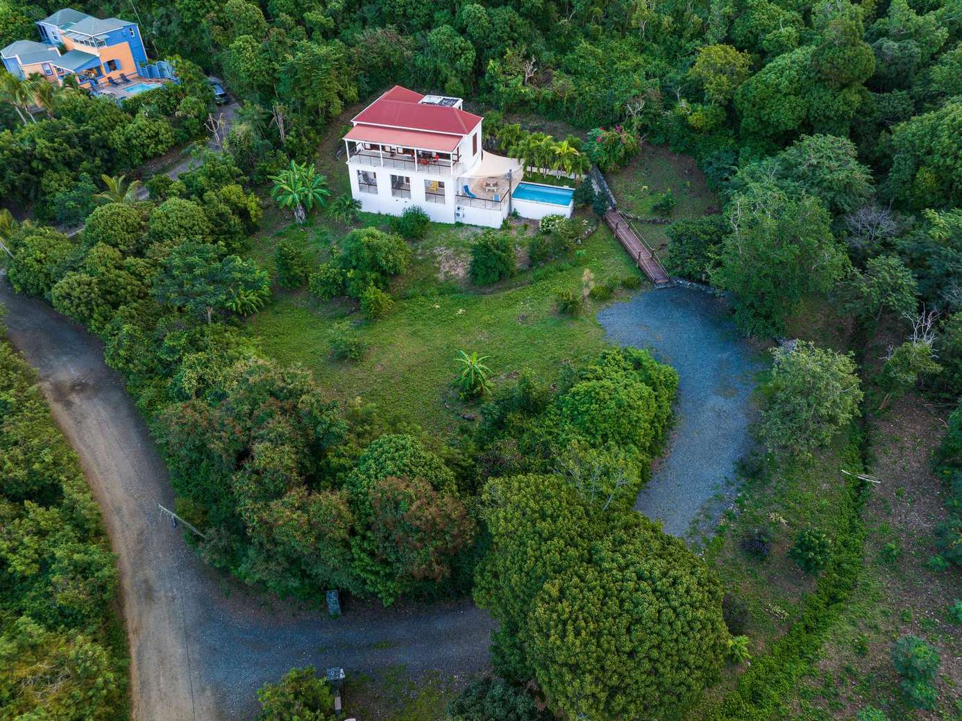 Secluded hillside villa with private pool and lush greenery