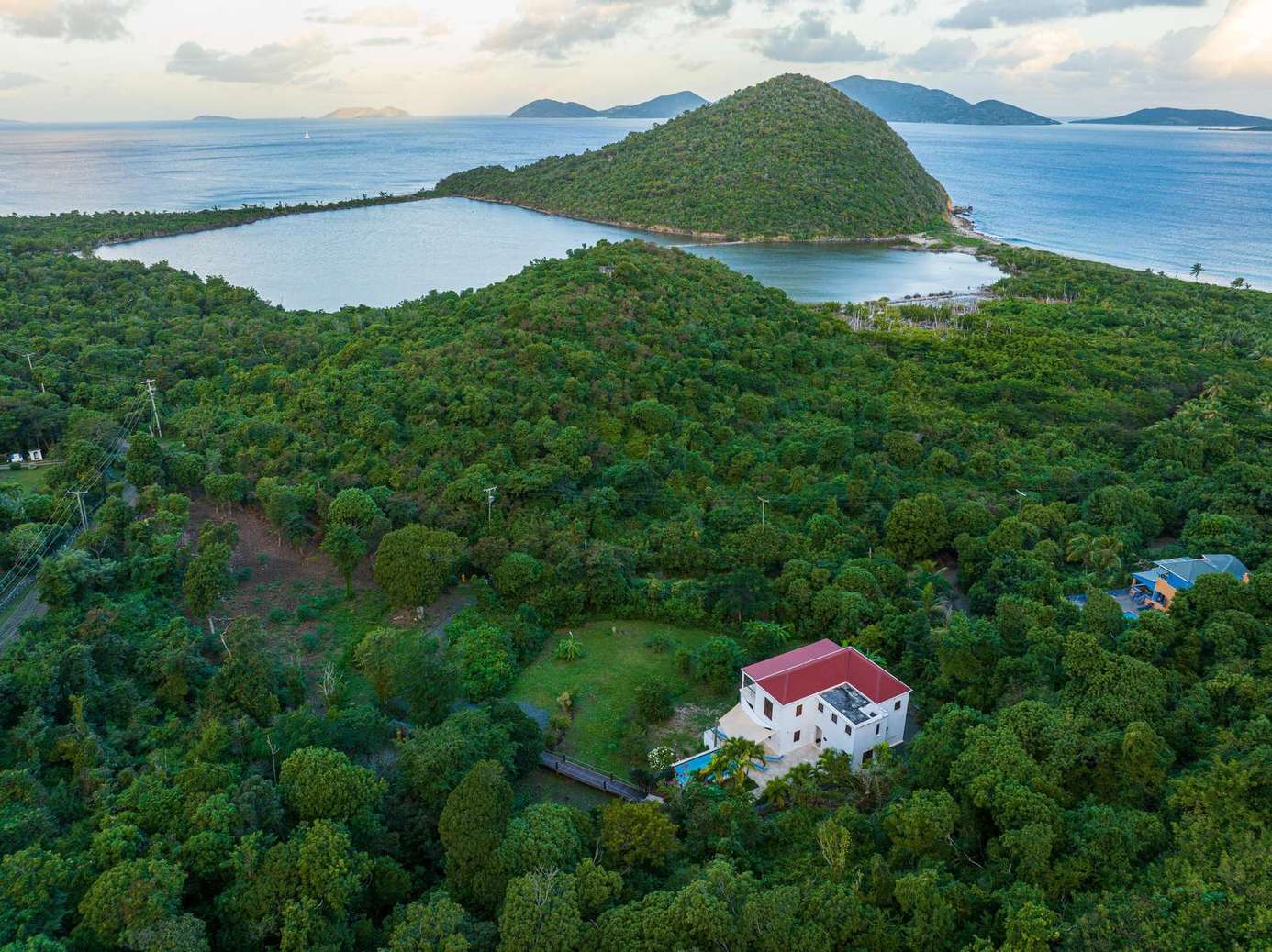 Secluded villa surrounded by lush greenery and ocean views