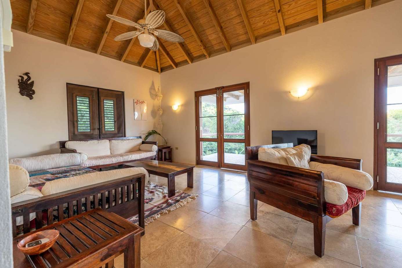 Spacious living room with vaulted ceiling and natural light