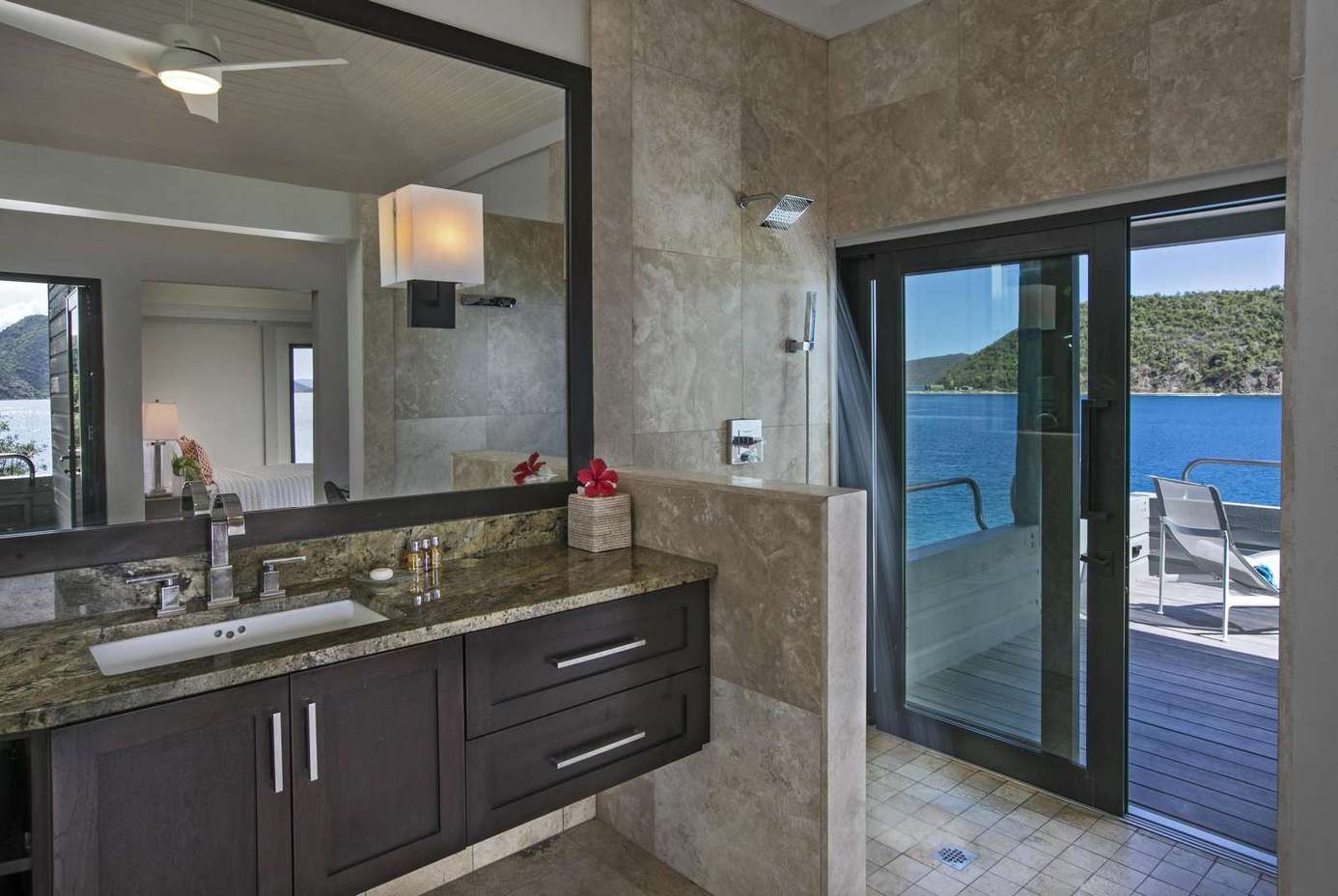 Modern bathroom with sleek vanity and private patio access