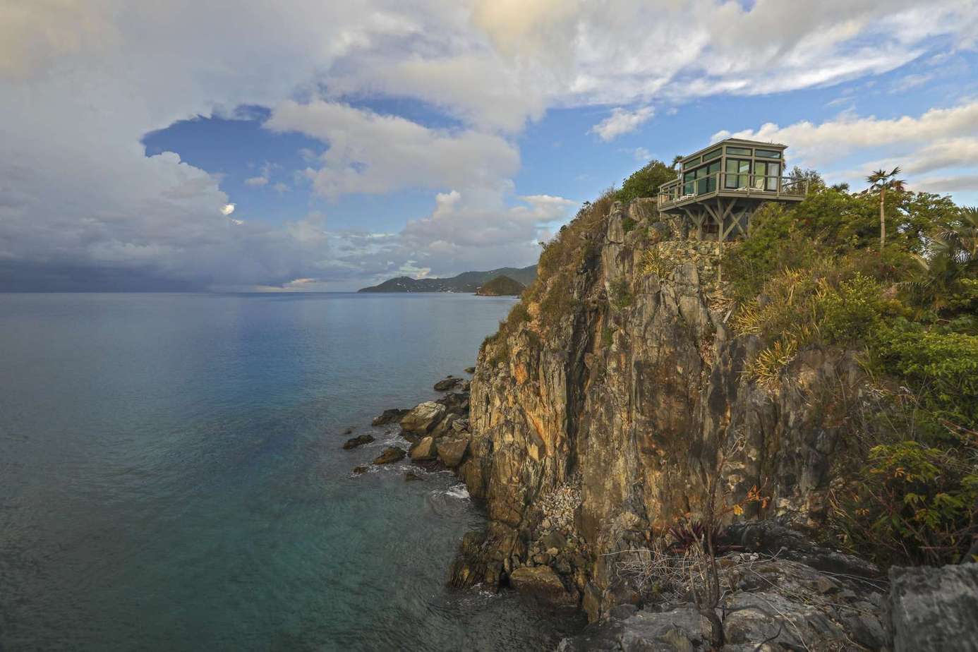 Secluded cliffside retreat with panoramic ocean views
