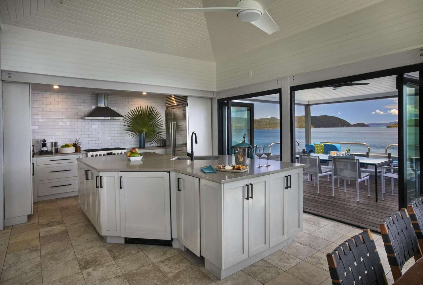 Spacious kitchen with panoramic water views and outdoor dining