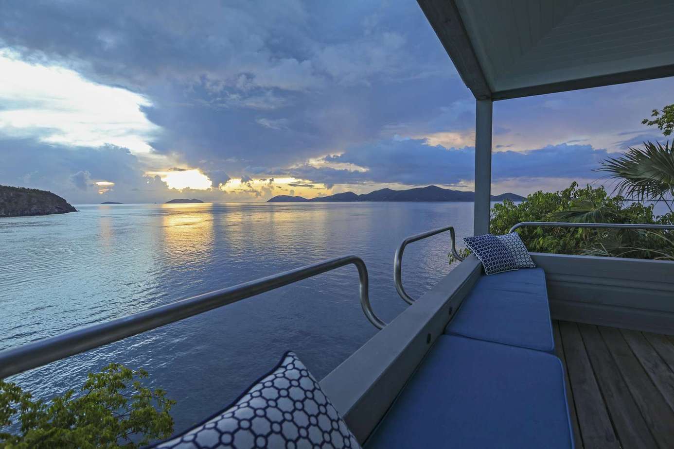Sunset views from the cozy oceanfront balcony retreat