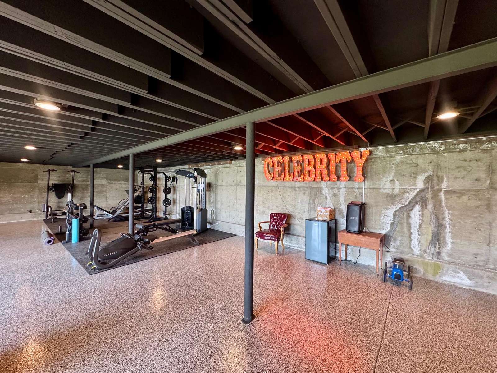 Olympic size Gym-  located below the garage