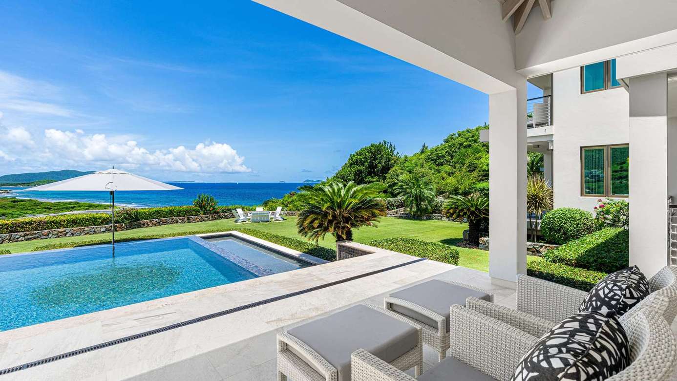 Ocean-view patio with pool and lush garden retreat