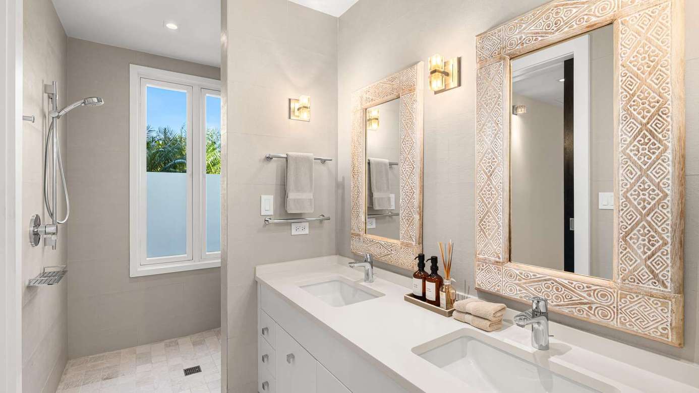 Bright, airy bathroom with dual sinks and natural light