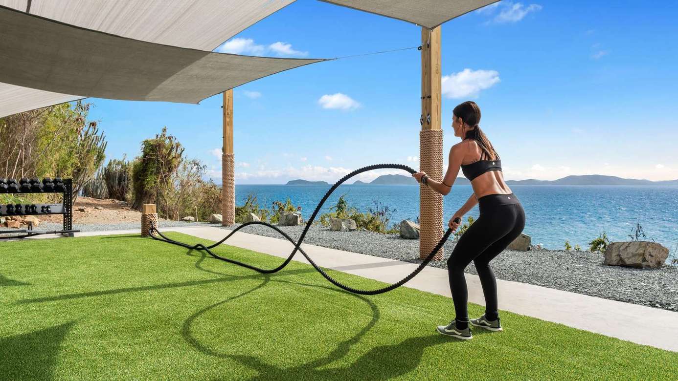 Lakeside patio with stunning views and open-air fitness space