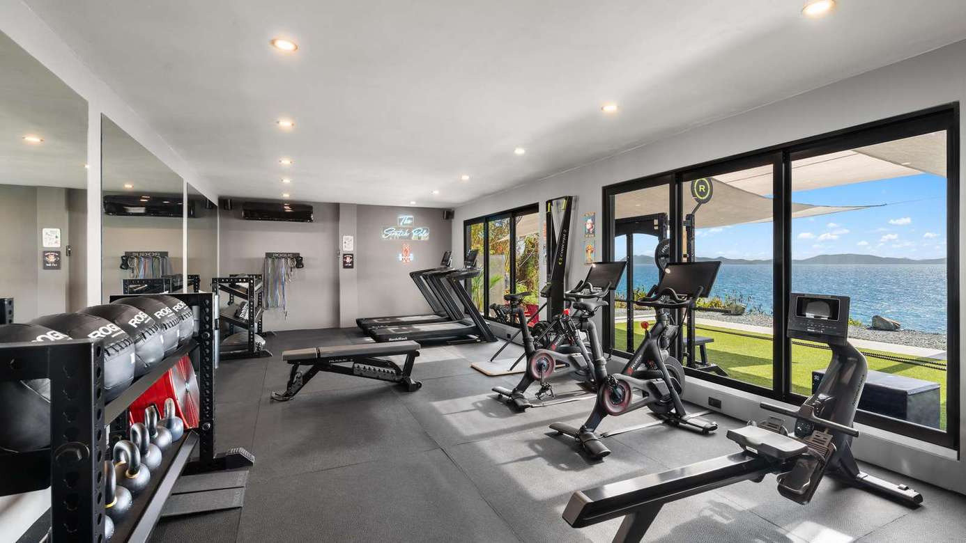 Modern gym with ocean views and natural light