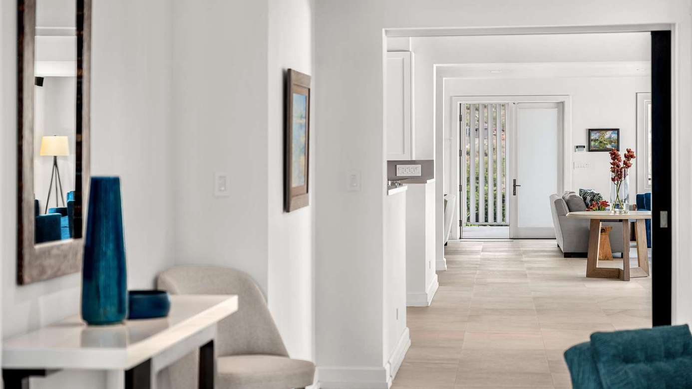 Bright, airy hallway leading to spacious living areas