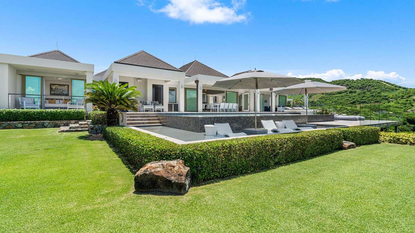 Spacious backyard with pool and serene garden views