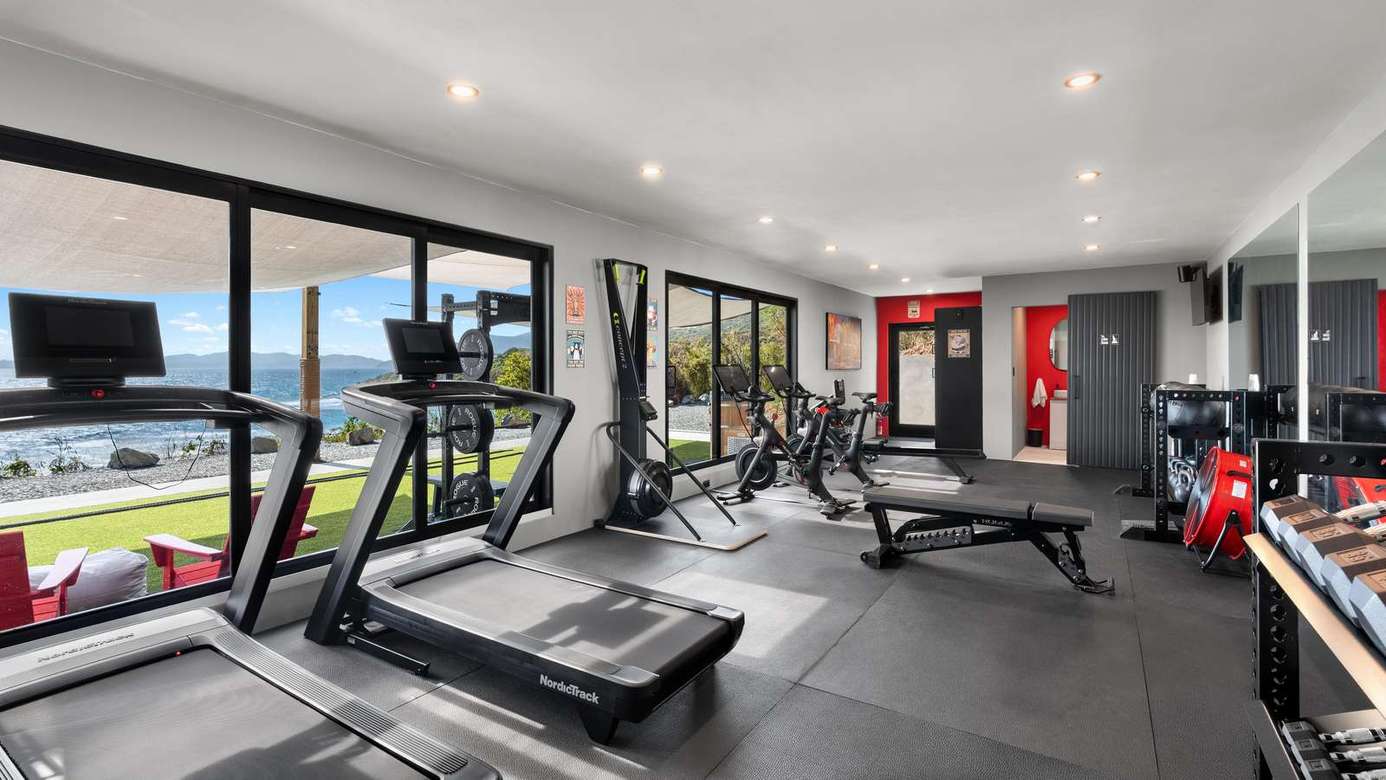 Bright, modern gym with panoramic waterfront views