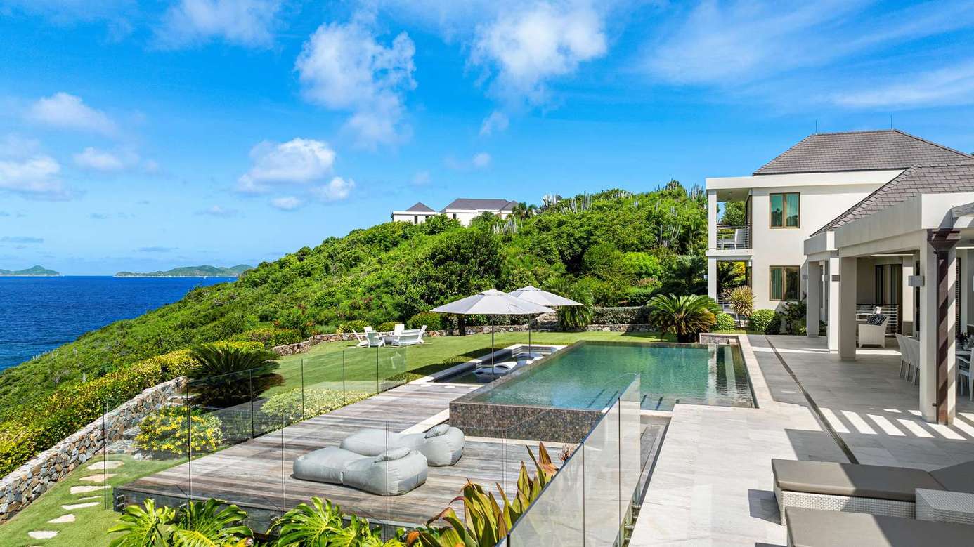 Ocean-view poolside retreat with spacious lounge and dining areas