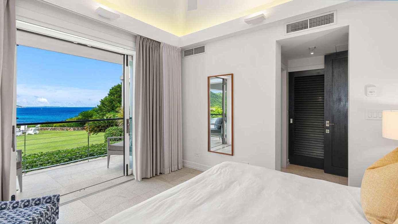 Ocean-view bedroom with seamless indoor-outdoor flow