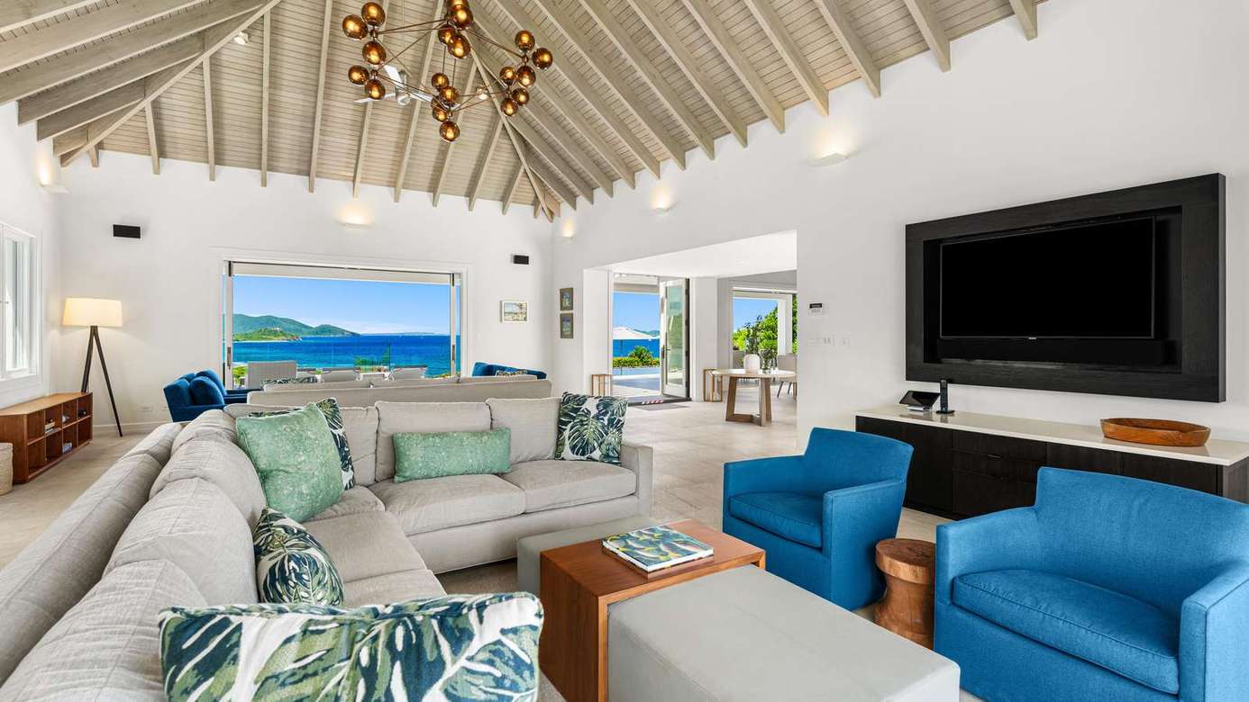 Spacious living room with ocean views and cozy seating