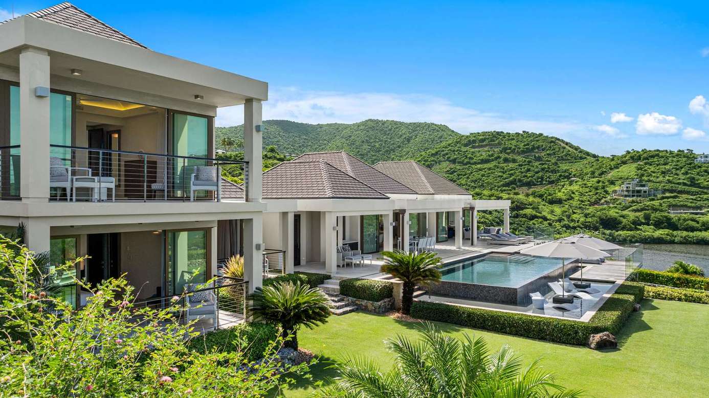 Modern patio with private pool and lush mountain views