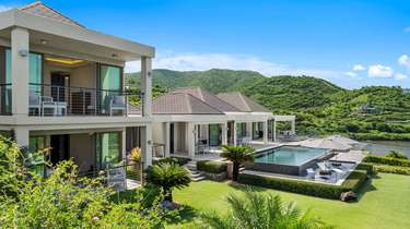 Modern patio with private pool and lush mountain views