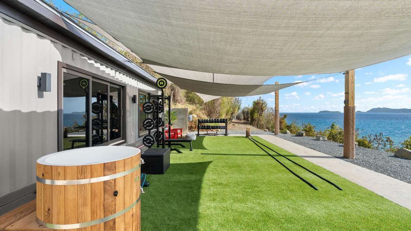 Spacious patio with ocean views and cozy hot tub retreat
