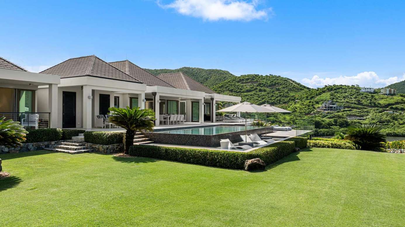 Sprawling outdoor oasis with pool and mountain views
