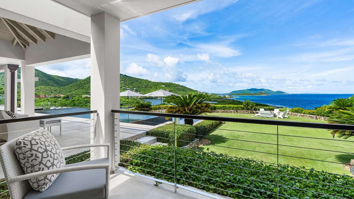 Relax on the spacious balcony with stunning ocean views