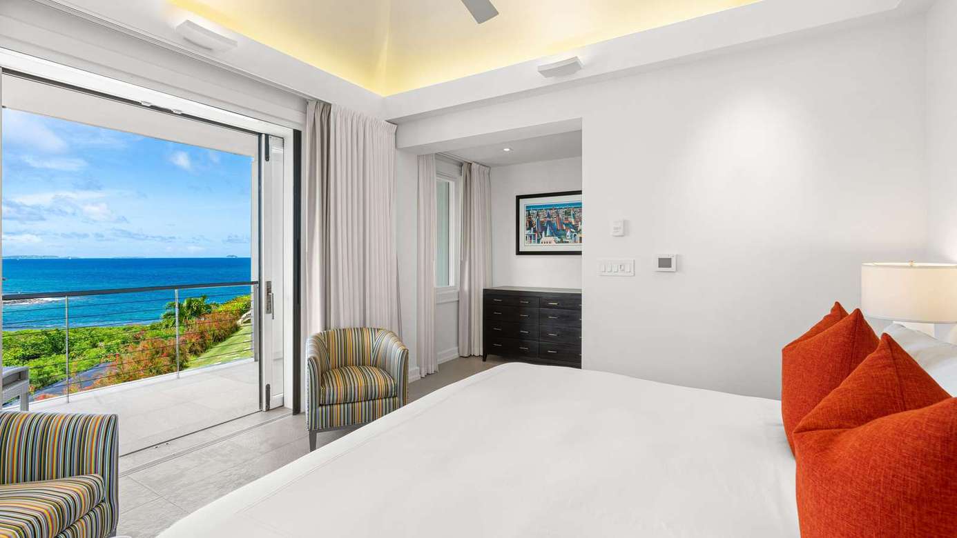 Ocean-view bedroom with serene coastal breeze and modern comfort