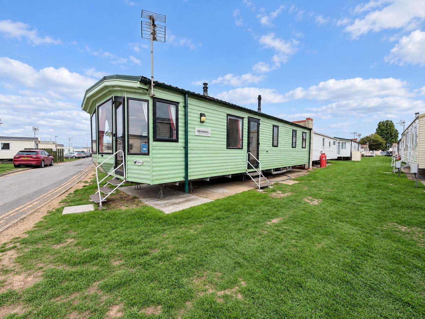 Stay in a comfortable 3-bedroom, 8-berth caravan at Naze Marine, perfect for families looking to enjoy Walton on the Naze beach. - property
