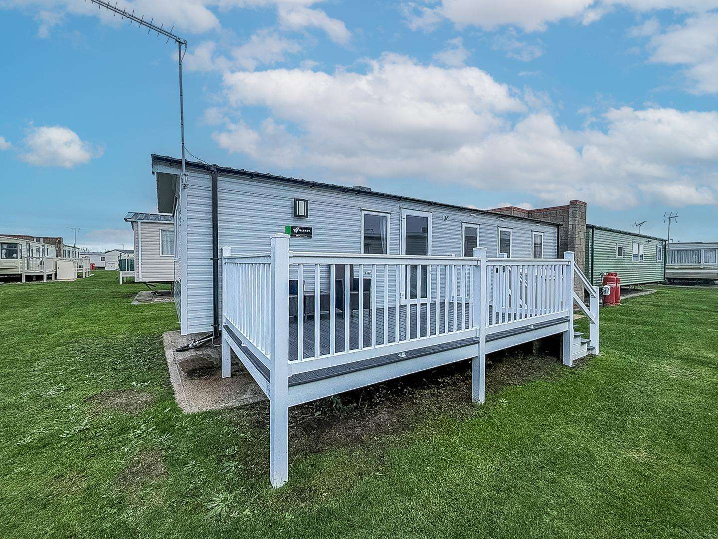 A caravan with decking is ideal for family holidays 2026, giving you a cosy space to unwind after a day of exploring Ipswich Town. - property