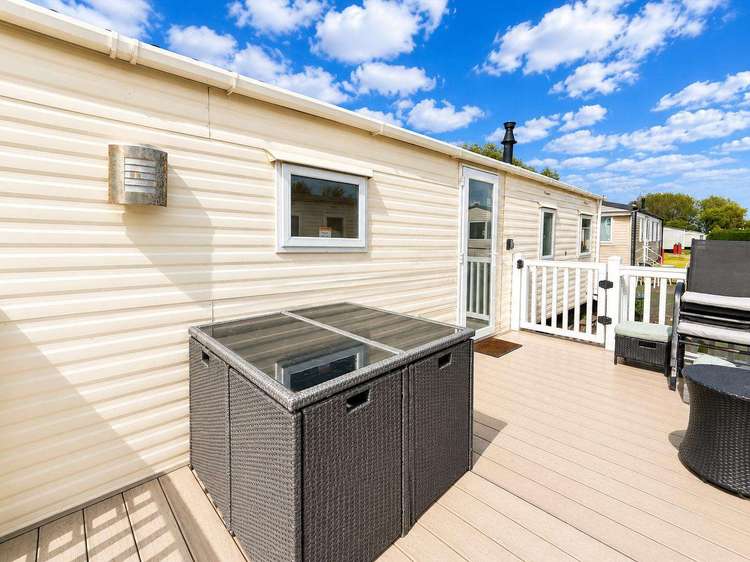 33027TC⭐ – The Cedars area, 3 bed, 8 berth caravan with decking, D/G & C/H. Ruby rated. Preview 0