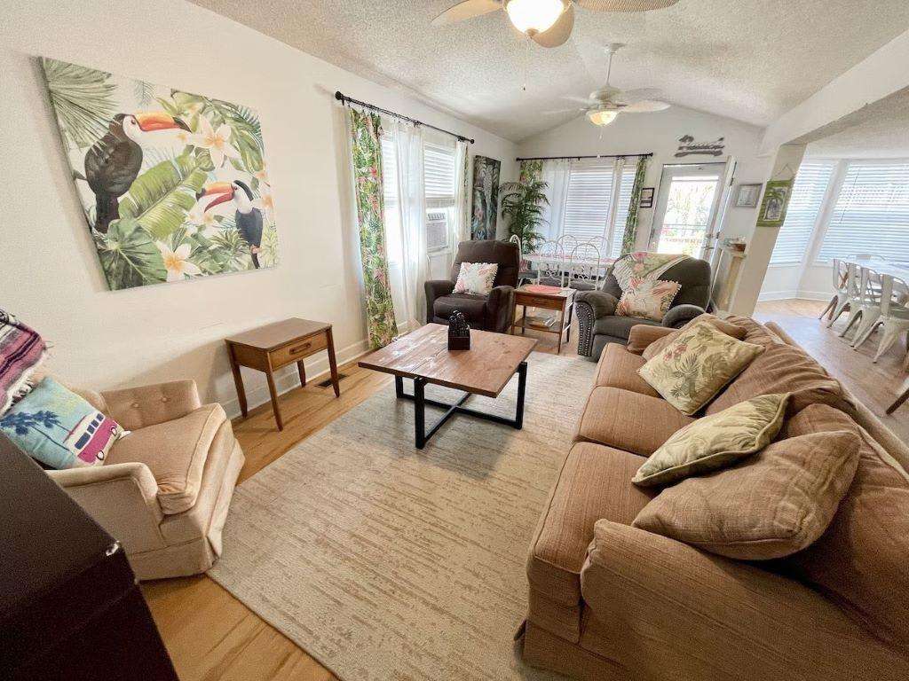 Spacious living room with cozy seating and natural light - property
