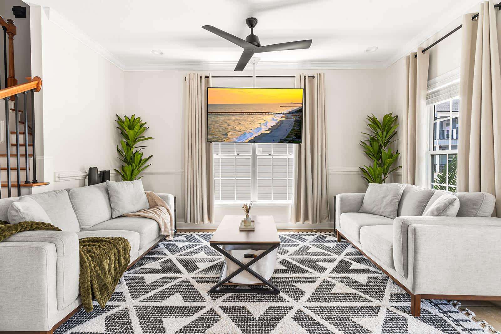Spacious living room with cozy seating and natural light - property