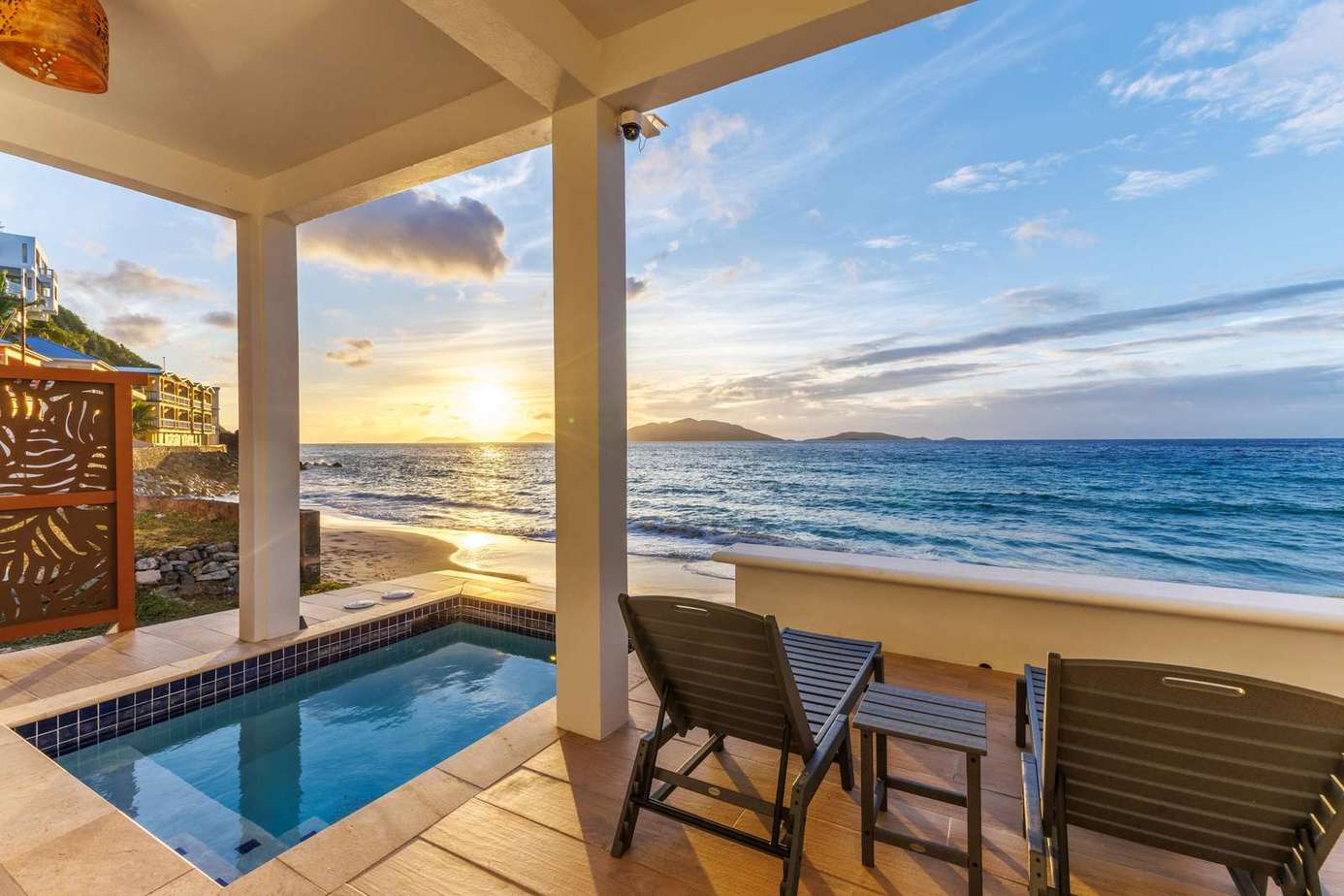 Oceanfront patio with private hot tub and sunset views