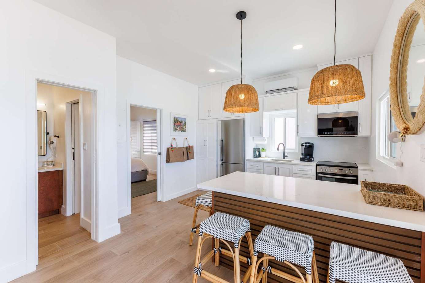 Bright, airy kitchen with stylish island seating and natural light