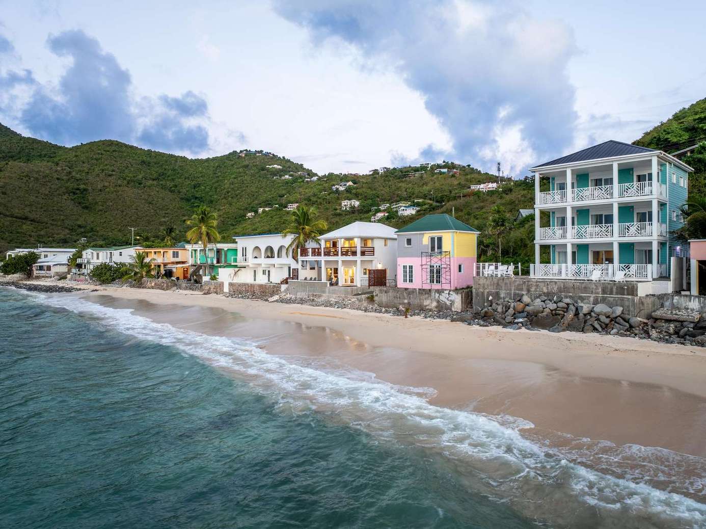 Charming beachfront view with colorful seaside cottages