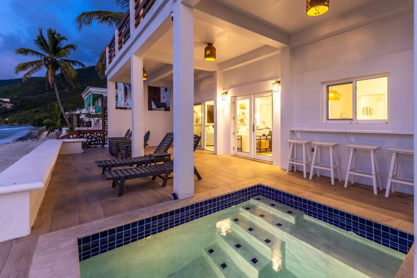 Private patio with cozy hot tub and ocean views