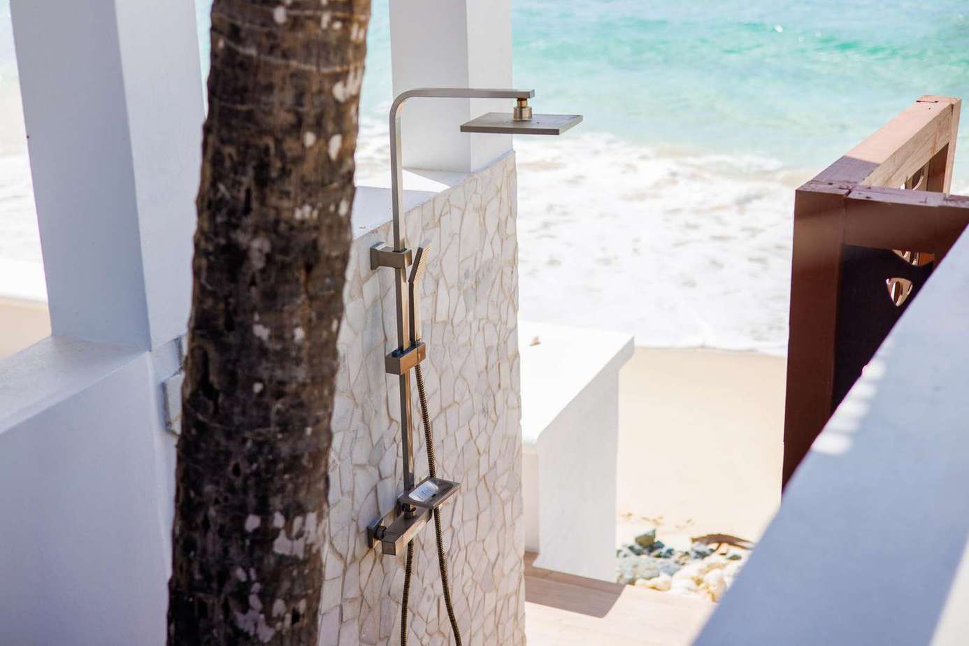 Outdoor beachside shower with ocean views for refreshing escapes