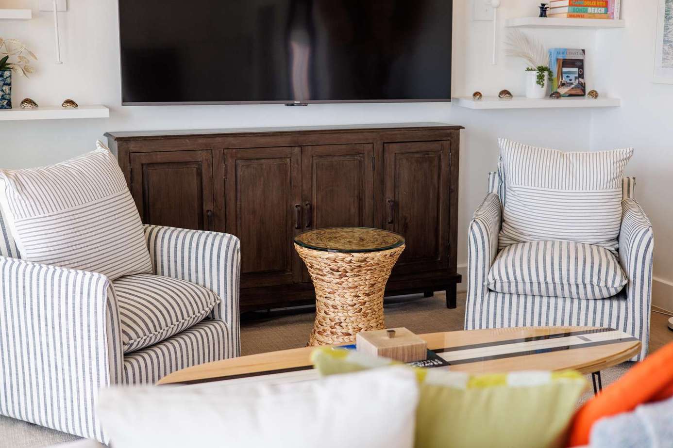 Cozy living room with striped armchairs and rustic charm
