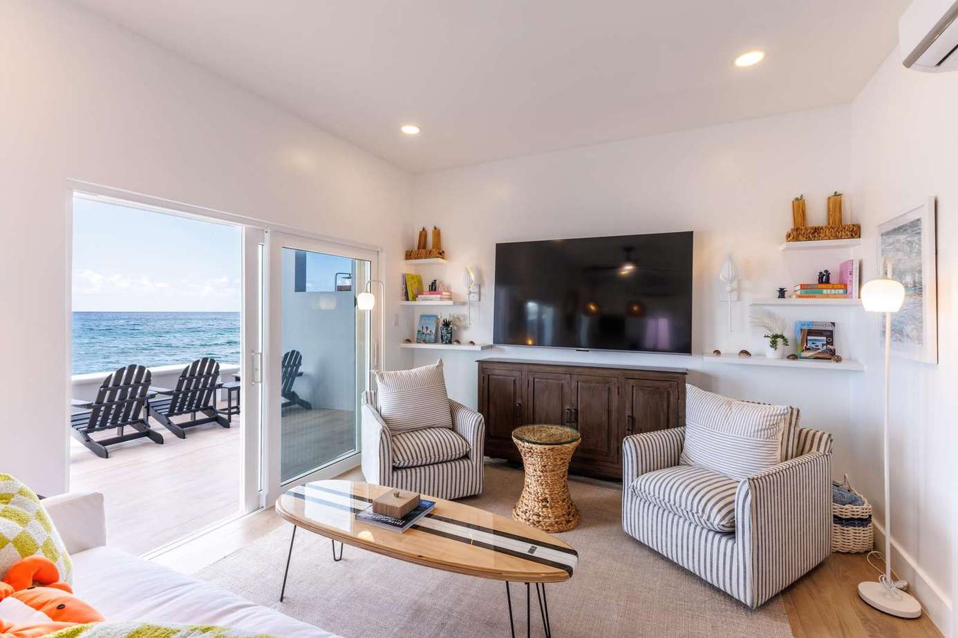 Bright living room with ocean views and cozy seating