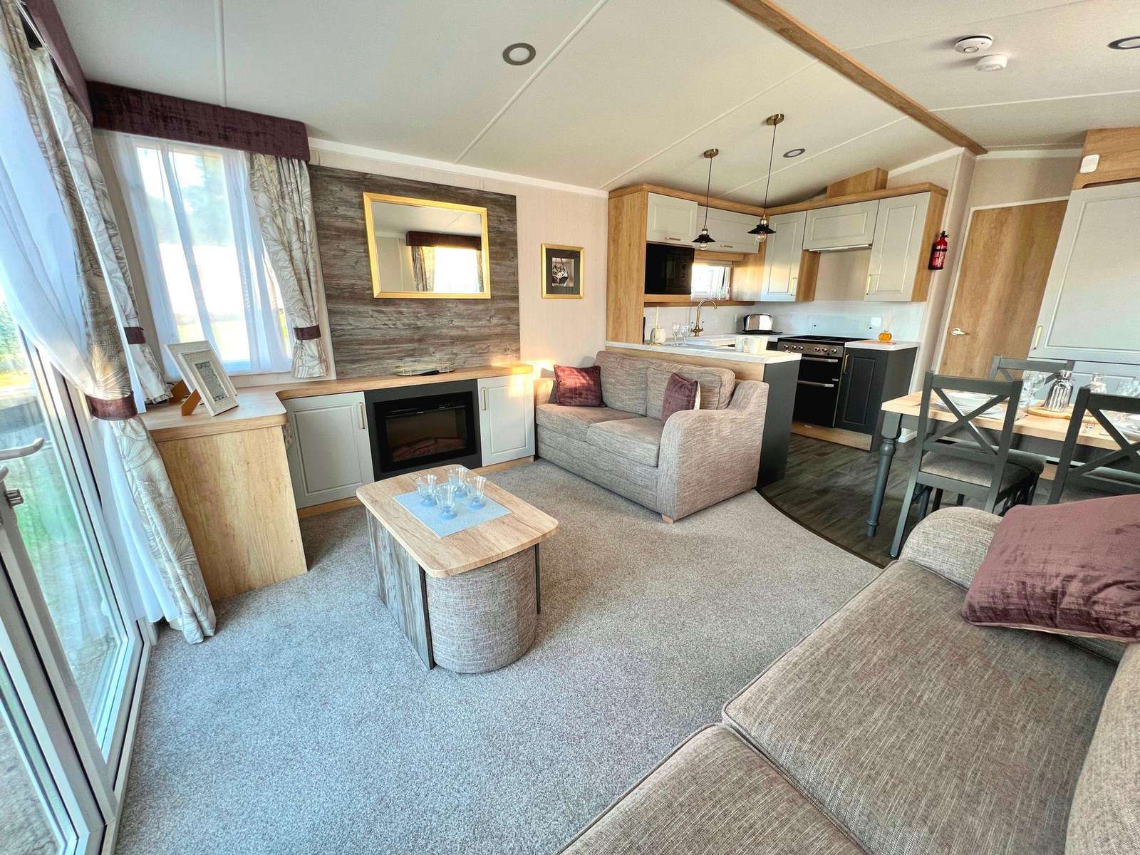 After a fun-filled day exploring Ipswich Town and catching a movie at Cineworld Ipswich, relax in the cosy living room of your caravan at Naze Marine part of Parkdean Resorts in Essex. - property