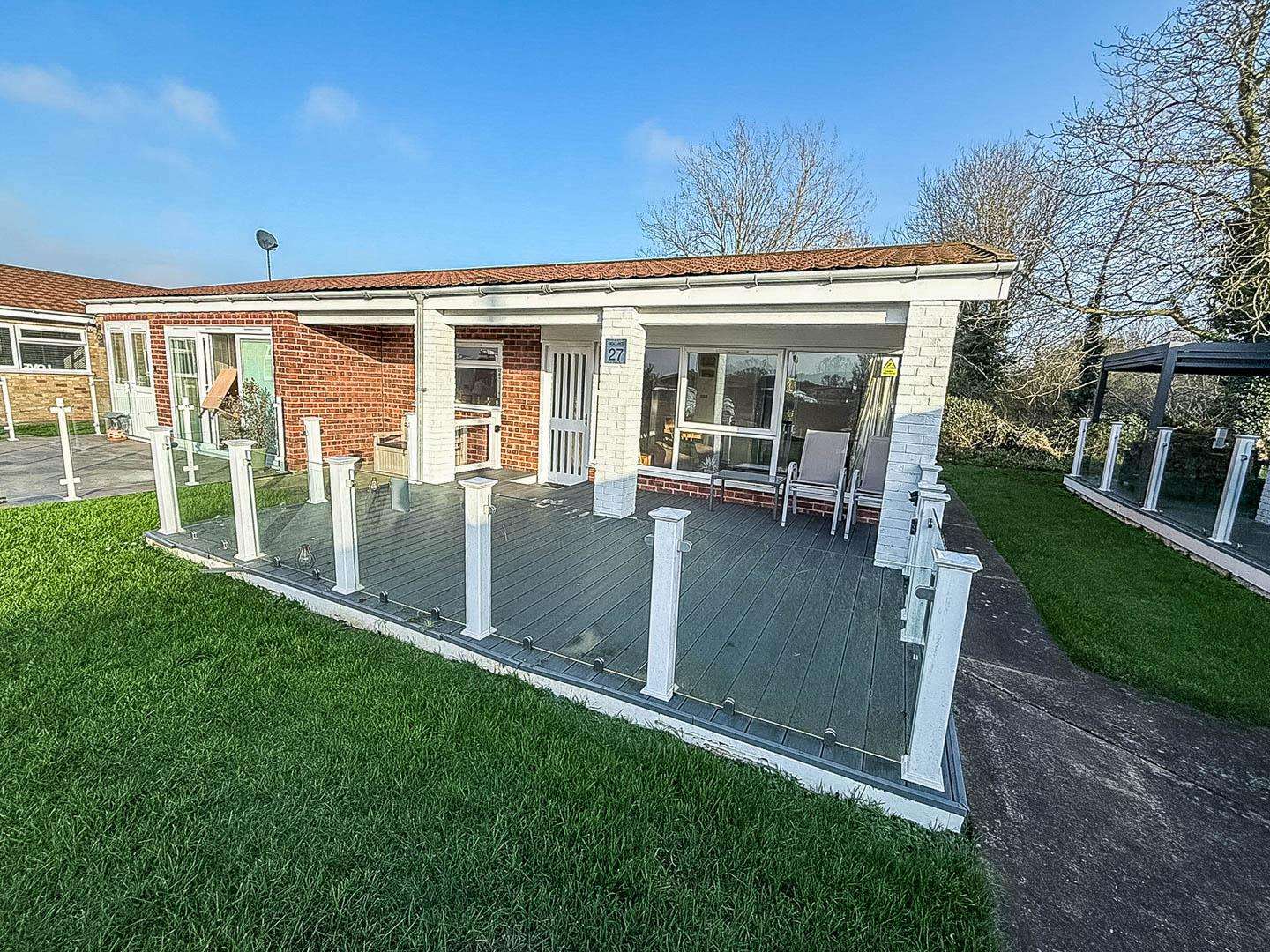 Holiday home decking is a great feature for creating a relaxing outdoor space for your weekend getaway - property