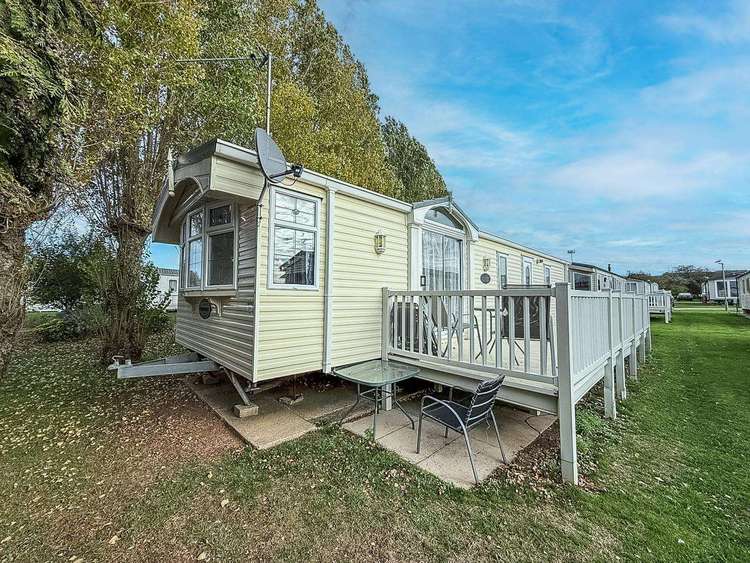 23029T⭐ – Tudor Area, 2 bed, 6 berth caravan with decking, D/G and C/H. Ruby rated. Preview 0