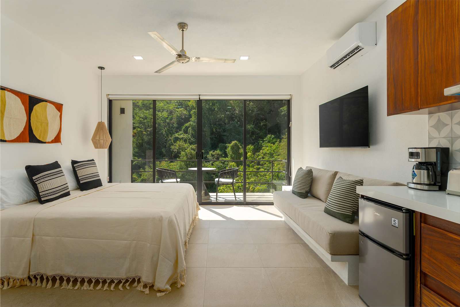 Bright, airy bedroom with garden views and modern comforts - property