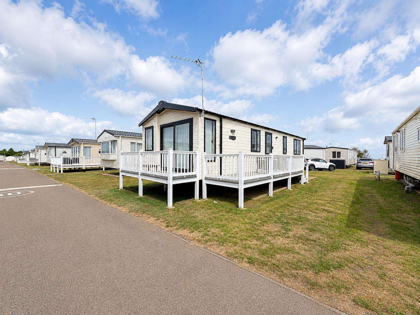 Picture yourself outside a caravan with decking, sipping your morning coffee at Pakefield Holiday Park, just steps away from the breathtaking Pakefield Beach—ideal for family holidays 2026 or spontaneous couple weekend getaways UK. - property
