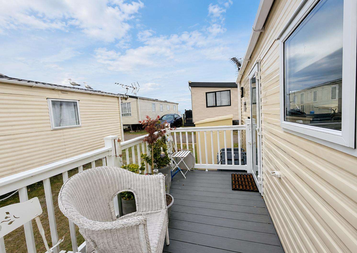 Relax with your own private decking on this beautiful caravan in Suffolk - property