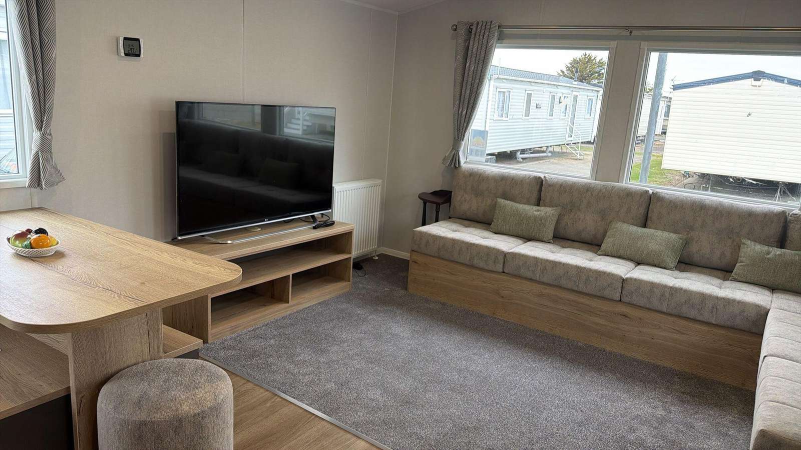 Bright, welcoming caravan lounge with comfy seating, soft touches and plenty of space to relax after a day out.
A cosy base for family breaks at Welcome Family Holiday Park, perfectly placed for enjoying caravan sites and UK campsites. - property