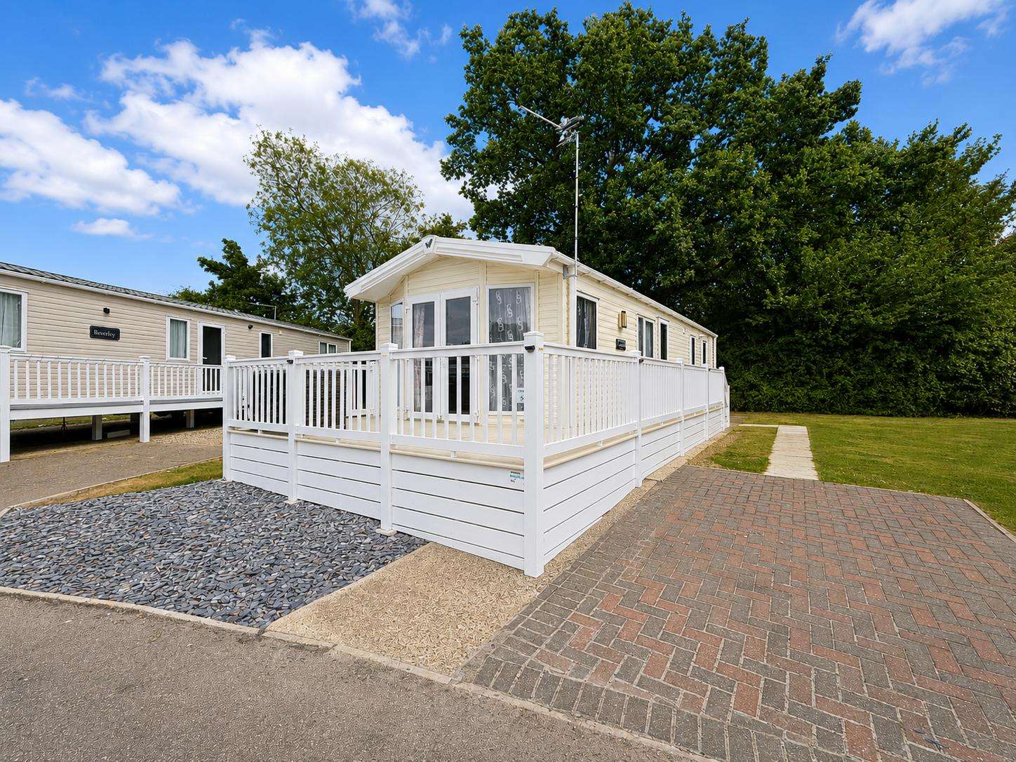 The base of this classic caravan is its wonderfully spacious open-plan lounge and dining area, designed for connection and comfort. Relax together after a day of adventure on the Suffolk coast. - property