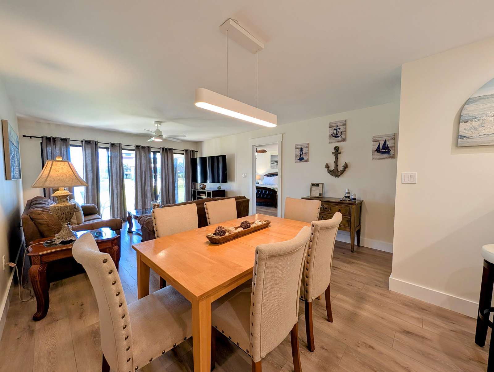 Spacious dining and living area with coastal charm - property