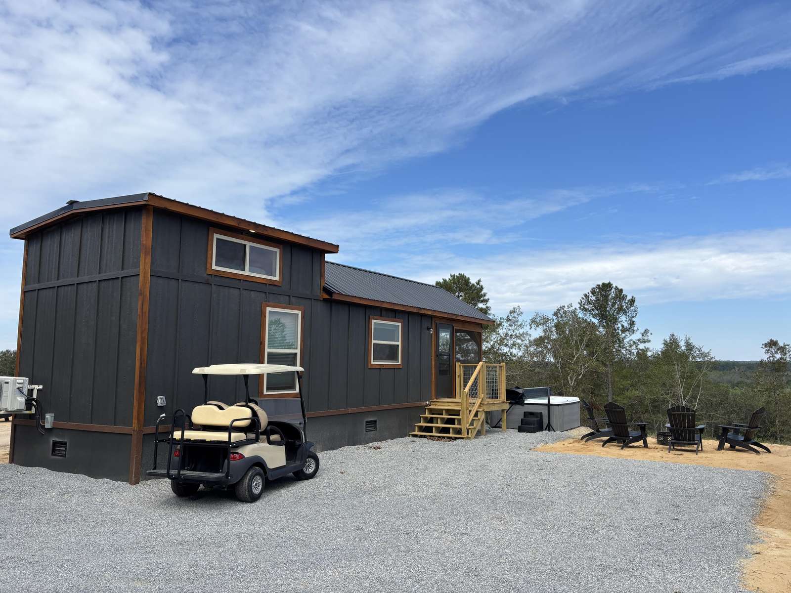 Spacious driveway and modern exterior for easy access and comfort - property